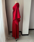 a red dress on a mannequin in a room