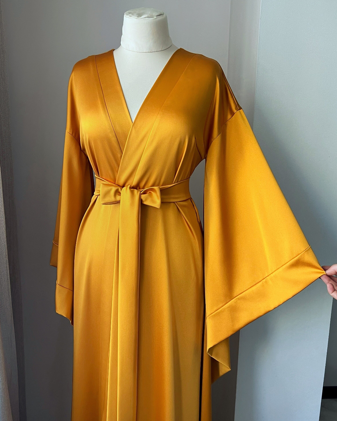 a woman's yellow dress on a mannequin