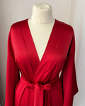 a woman's red dress on a mannequin