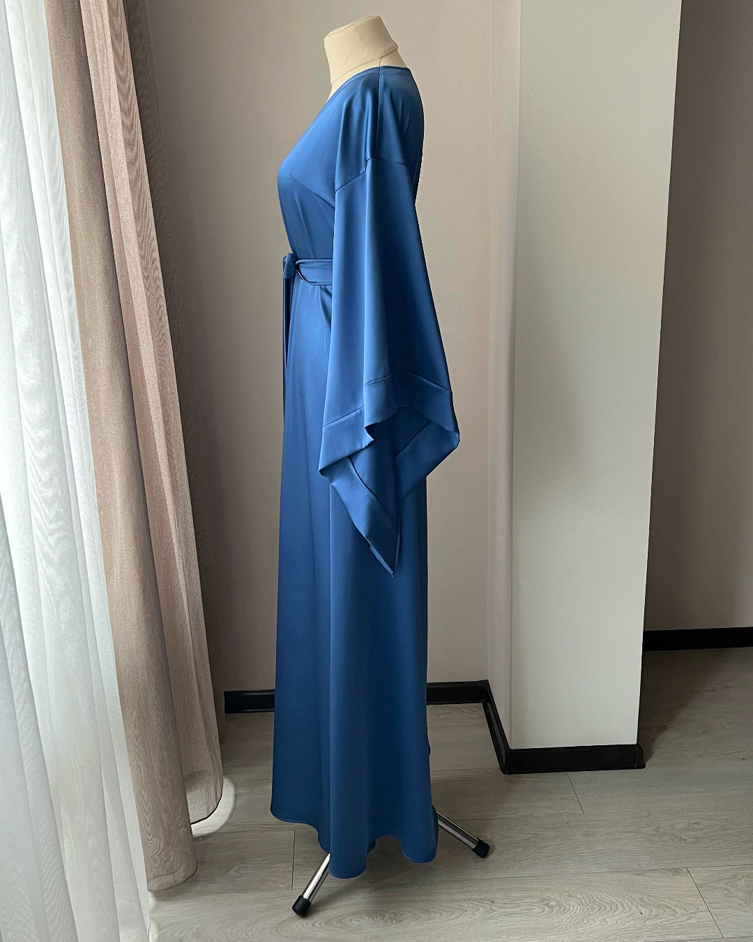 a dress on a mannequin in a room