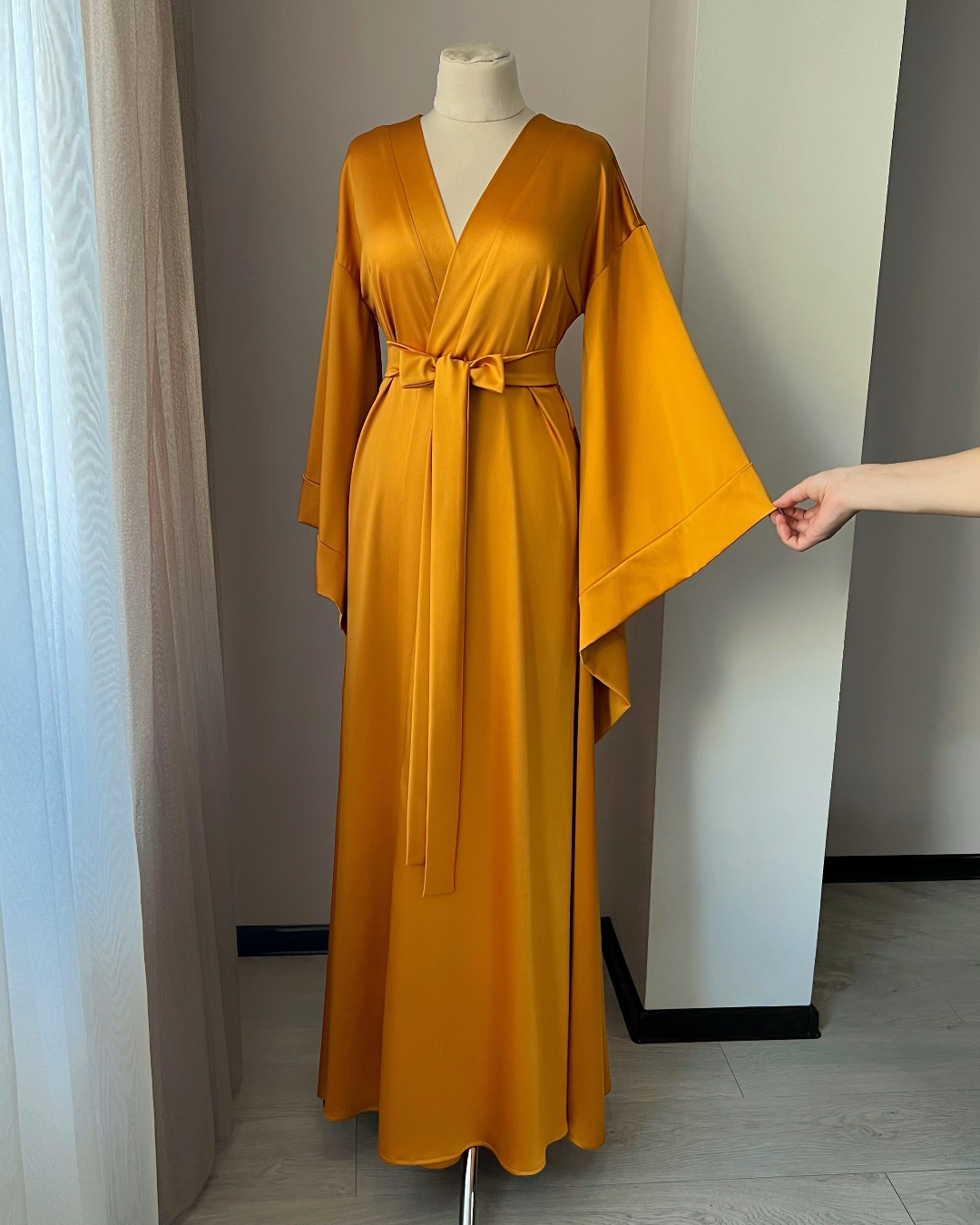 a woman's yellow dress on a mannequin