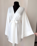 a white robe on a mannequin on a dummy