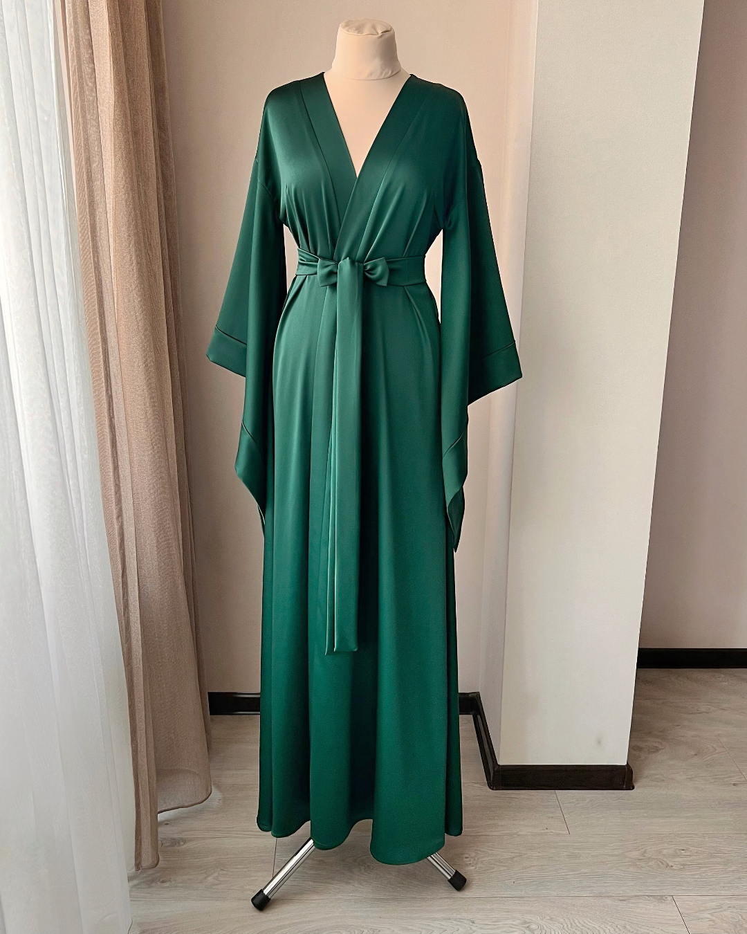 a woman's green dress on a mannequin