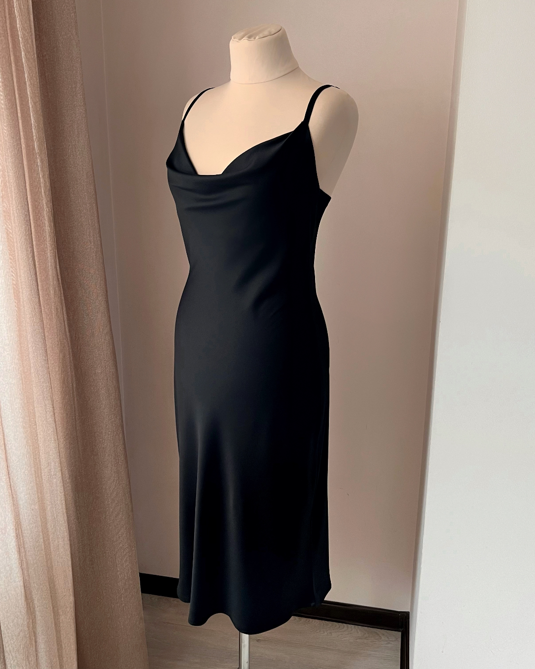 a dress on a mannequin in a room