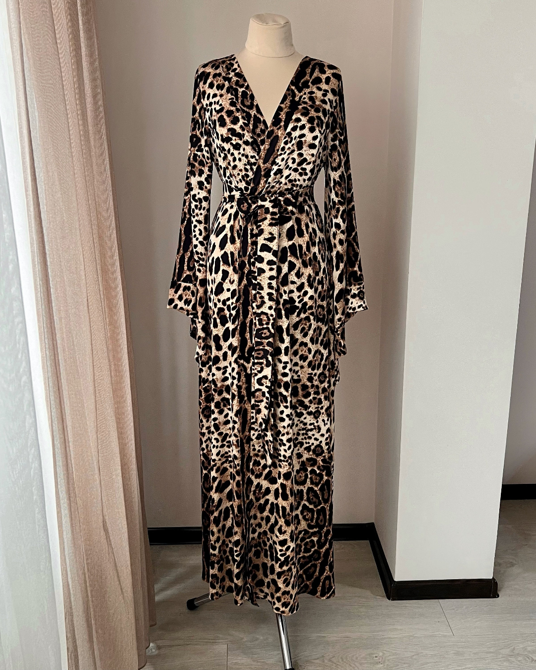 a leopard print dress on a mannequin