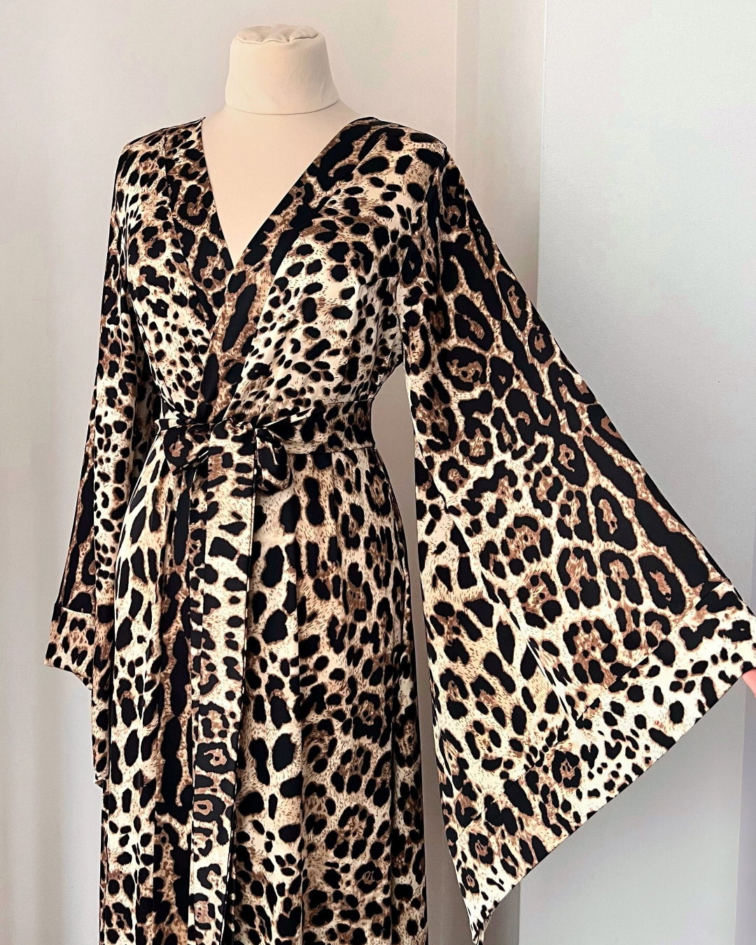 a leopard print dress on a mannequin